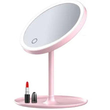 Pink vanity mirror with LED light ring and touch-control button on screen.