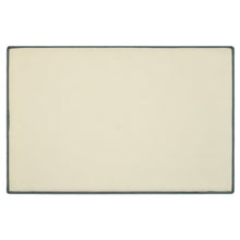 Cream bath mat with dark edging and smooth backing