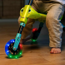 Yellow LED 3-wheel trike with glowing wheels, child holding the handlebar