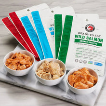 SeaBear ready-to-eat wild salmon pouches with bowls of smoked salmon