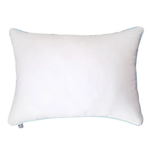 White pillow protector with light blue edge piping and small tag detail