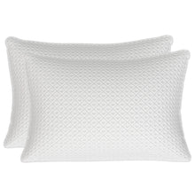 White quilted luxury pillows, two sizes layered with patterned faces