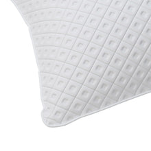 White pillow corner with quilted diamond texture fabric
