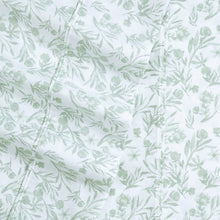 Light green botanical microfiber fabric with leaf and sprig pattern