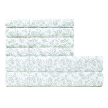 Microfiber sheet set with light green botanical print, four stacked fitted sheet layers