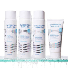 Gentle shampoo and conditioner bottles plus body wash, unscented, white with blue wave design