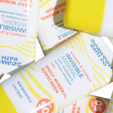 Invisible mineral sunscreen SPF 50 tube close-up, striped label and SPF badge