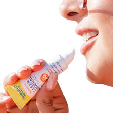 Hydrating lip shine being applied to lips from a squeeze tube