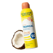 Tropical SPF 50 quick-dry sunscreen spray bottle with coconut accent, orange cap