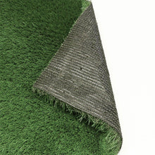 Artificial grass roll edge showing green pile and gray backing underside