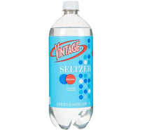 Vintage seltzer water bottle with blue label and clear liquid, original flavor