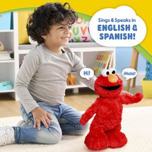 Red Elmo plush being held, with open smiling mouth and big white eyes