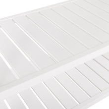 White slatted lower shelf on a kitchen cart with open storage