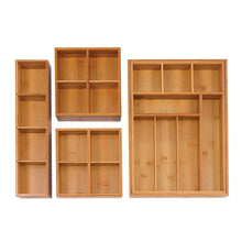 Bamboo drawer organizer pieces displayed, including small cubbies and a larger grid