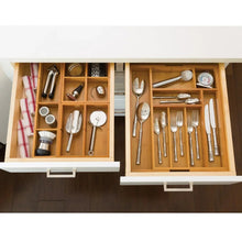 Bamboo kitchen drawer organizer with utensil slots and section dividers