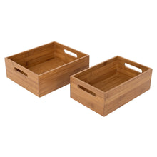 Two empty bamboo storage bins with cutout handles, square and rectangular