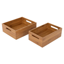 Two bamboo storage bins with cutout handles and open tops
