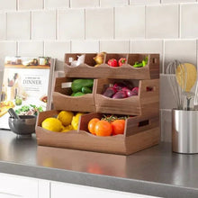 Acacia stacking storage bins set with four open compartments, filled with produce and pantry items