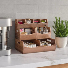 Acacia stacking storage bins set with four open compartments, holding jars and bottles