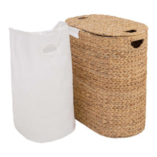 Water hyacinth laundry hamper with white liner and removable white fabric storage bag