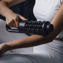 Motorized rolling massager applying rollers to a leg in seated position