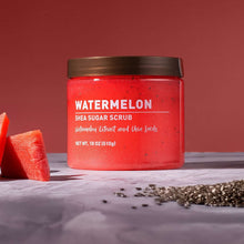 Watermelon shea sugar scrub jar with brown lid, red scrub surface and chia seeds.