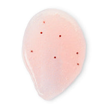 Pink shea sugar scrub scoop with small particles, smooth exfoliating texture