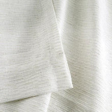 Sheer linen-blend curtain folds with textured pattern, light neutral sheer fabric