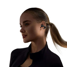 Open-ear true wireless earbuds worn on ear, dark gray