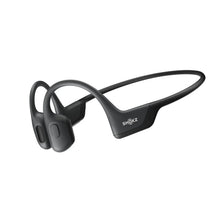 Open-ear wireless headphones with dark gray ear hooks and open speaker pads
