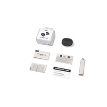 Earbuds packaging set with charging case, warranty card, and accessories