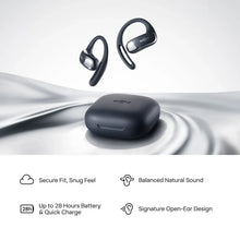 Black open-ear true wireless earbuds with charging case and ear tips, side view.