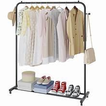 Black freestanding rolling garment rack with wheels, hanging bar, and shoe shelf