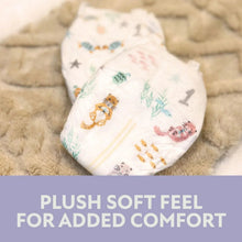 Folded baby diaper on soft fabric with cute animal and star prints