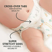 Close-up of a baby diaper showing cross-over tabs and stretchy side edges