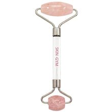 Rose quartz facial roller with two pink stone ends and chrome handles