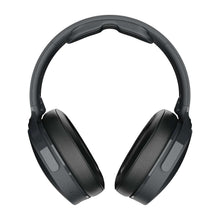 Over-ear wireless headphones showing two padded earcups and headband, dark finish