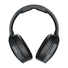 Over-ear wireless headphones front view with padded earcups and headband, dark finish