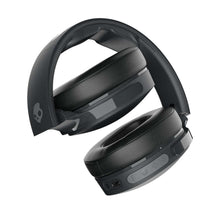 Over-ear wireless headphones with folding design and cushioned earcups, dark finish