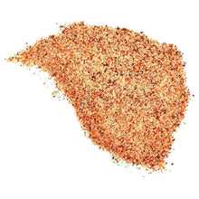 Cajun seasoning spice pile with red, brown, and beige granules
