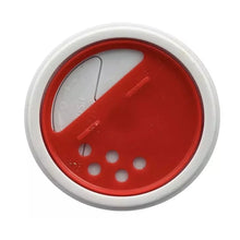 Red spice lid end cap of a seasoning can with white rim