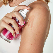 Post wax + shave oil bottle being applied to upper arm skin