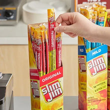 Slim Jim Original 6g meat sticks multipack, hand holding a stick among cartons.