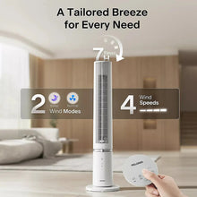 White tower fan with control panel and remote held in a hand