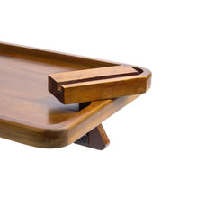 Wood armrest tray with dark pull-out handle detail and rounded tray edge