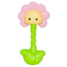Pink flower-top ladybug teether with yellow face and green handle