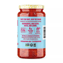 Raspberry fruit spread jar with ingredient panel and nutrition callouts; red spread inside