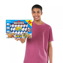 Child holding Dinosaur Smashers Smash Egg 20-pack toy box
