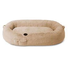 Beige round plush dog bed with paw-print opening