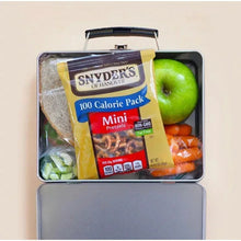 Mini pretzels 100-calorie pack in open lunch box with apple and sliced fruit